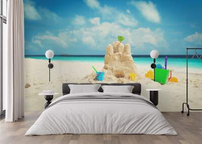 Sand castle on beach and kids toys Wall mural