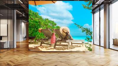 Two beach chairs on tropical vacation, relax at sea Wall mural