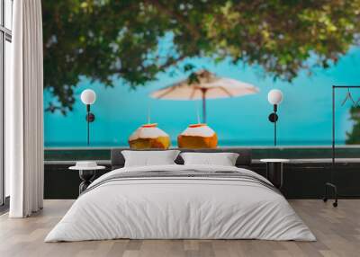 two coconut drinks on tropical beach resort Wall mural