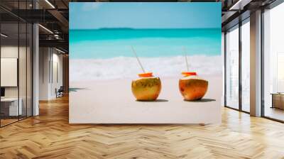 two coconut drinks on tropical beach vacation Wall mural