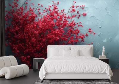  a bouquet of red flowers sitting on top of a blue table next to a white wall with a black frame around it and a black border around the corner of the picture. Wall mural