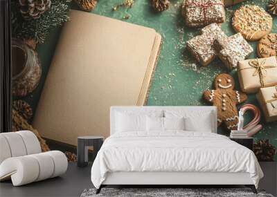   A green table sits with a book atop it, beside Christmas cookies and candy canes Wall mural