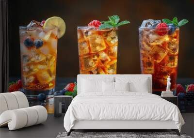  A group of glasses filled with various iced teas, fruit-topped table, strawberries, raspberries adjacent Wall mural