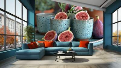  a plate topped with cups filled with figs next to a potted plant and a plate with two figs on top of it and a plate with a few figs on it. Wall mural