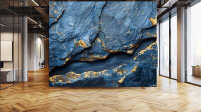   A tight shot of a blue stone, encrusted with gold foil along its sides Adjacent is a black rock, adorned with gold foil at its edges Wall mural