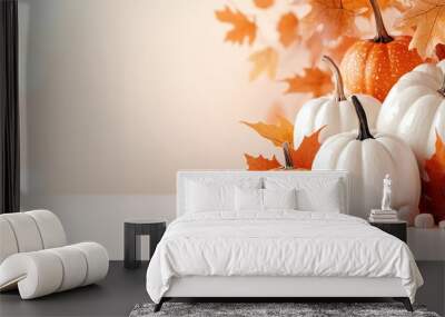   White pumpkin group atop orange-white leaf cluster on table Wall mural