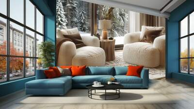 a living room with two chairs and a table in front of a window with a view of snow covered trees. Wall mural