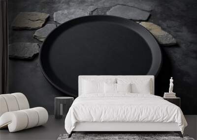 Black plate on stone table, top view. Empty space for menu or recipe, cinematic composition. Ceramic black platter on stone table, mockup. Concept of elegance dark table setting. Generative AI Wall mural