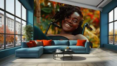 Smiling young african american woman in a wheelchair. Selfie outdoors photo. Wall mural