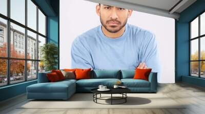 Portrait, angry and man with arms crossed, frustrated and upset guy against a white studio background. Face, male person and model with anger, expression and frustration with emotion and conflict Wall mural