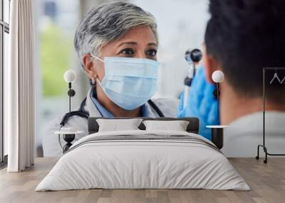 Woman, doctor and face mask with patient for exam, checkup or healthcare appointment at hospital. Female person or medical professional with protection checking ill or sick man with flu at clinic Wall mural