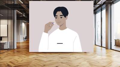 Medicine and healthy lifestyle concept, a young male Asian character taking a pill Wall mural