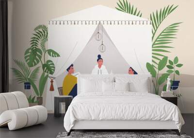 Summer garden tent, outdoor events, boho style marquee with pillows and other decorative elements, beautiful tropical plants, a group of friends sitting inside Wall mural