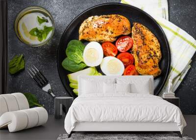 Buddha bowl quinoa salad with chicken and vegetables on black. Wall mural