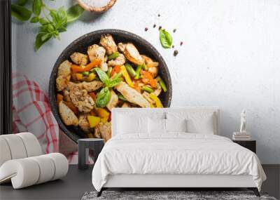 Chicken fried with vegetables. Wall mural