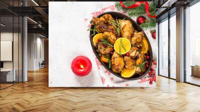 Christmas food - roasted chicken with orange on white table. Wall mural