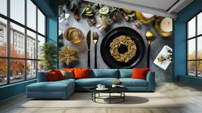 Christmas table setting with eucalyptus leaves and golden decorations. Top view at stone table. Wall mural