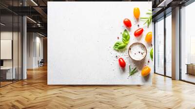 Food background on white background. Fresh vegetables, herbs and spiceswith wooden cutting board. Ingredients for cooking with space for text. Wall mural