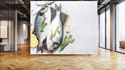 Fresh fish dorado on blue background. Wall mural