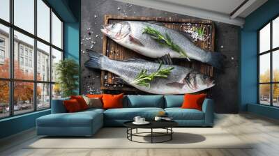 Fresh fish seabass on black background. Wall mural