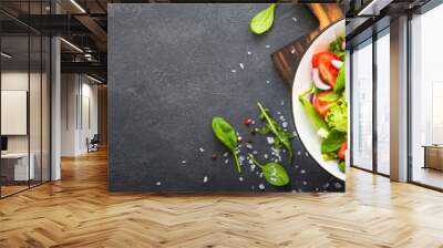 Green salad from leaves and tomatoes. Wall mural