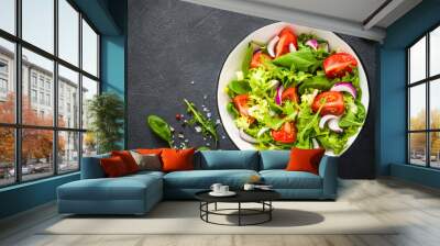 Green salad from leaves and tomatoes. Wall mural