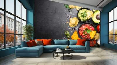 Latinamerican food party sauce guacamole, salsa, chips and ingre Wall mural