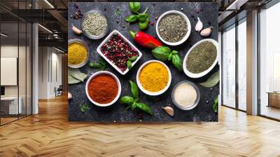 Set of Various spices and herbs on black stone table. Wall mural