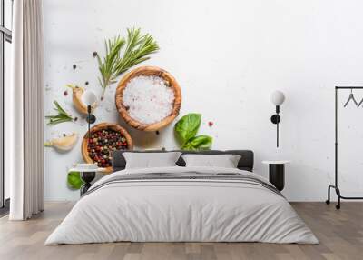 Spices and herbs over white stone table top view. Wall mural