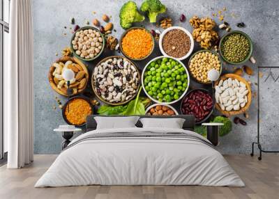 Vegan protein source. Legumes, beans, lentils, nuts, broccoli, spinach and seeds. Top view on stone table. Healthy vegetarian food. Wall mural