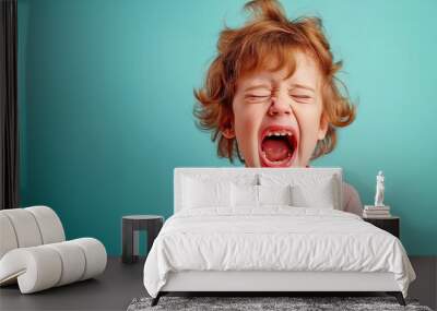 emotional close-up of a young girl screaming and crying in a pink shirt, set against a blue background, capturing the raw intensity of children's emotions within the family context Wall mural