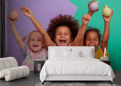 happy, multiracial children celebrating Easter with colorful eggs, arms raised, and joyful expressions, isolated on a vibrant purple and green background, capturing the essence of the spring holiday Wall mural