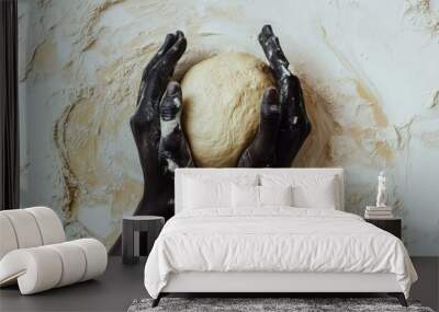 top view of black woman’s hands kneading dough on a white background, showcasing natural beauty and strength in food preparation with a minimalist, bright kitchen setup Wall mural