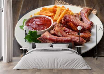 Pork ribs and tomato sauce on white plate Wall mural