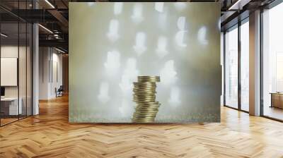 coins stacked on a dark background with bokeh of hearts and arrows Wall mural