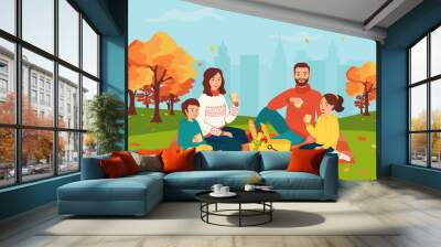 Happy family with two children on a picnic in the autumn city park. The concept of an outdoor weekend in the fall. Mom, dad, son, daughter are sitting together in nature. Cute vector illustration Wall mural