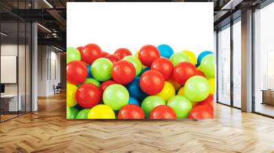 Colored plastic balls in pool of game room. Dry Swimming pool for fun and jumping in colored plastic balls. The concept of celebration and fun Wall mural