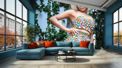 Beautiful girl in beach suit. Wall mural