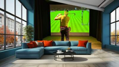 Man playing golf on screen and golf simulator Wall mural