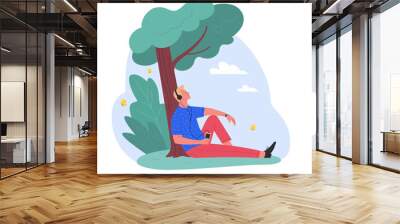 alone at the fresh air. vector illustration of young cartoon blond man sitting under the tree in a p Wall mural