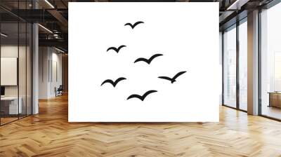 A flock of flying silhouette birds. Vector illustration Wall mural