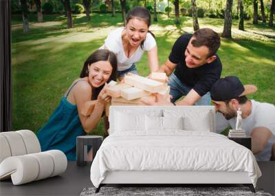 Friends playing board game outdoors. Wall mural