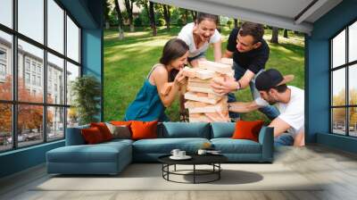 Friends playing board game outdoors. Wall mural