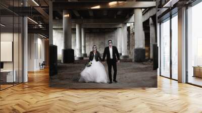 Halloween couple. Dressed in wedding clothes romantic zombie Wall mural