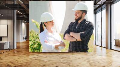 two workers wearing protective helmet works at electrical power station. Wall mural