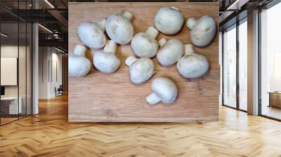 Bamboo cutting board with button mushrooms Wall mural