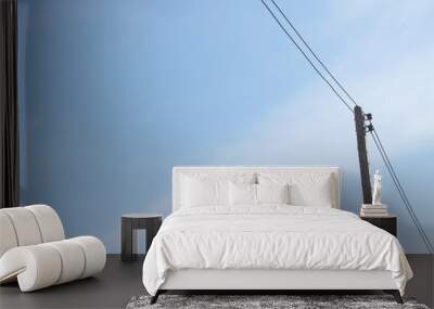 Electric pole with sky background. Wall mural