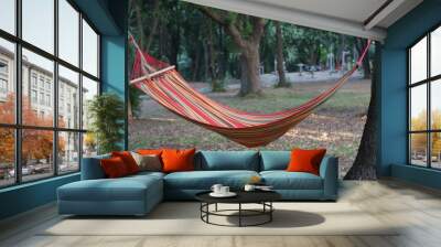 Hammock between two trees Wall mural