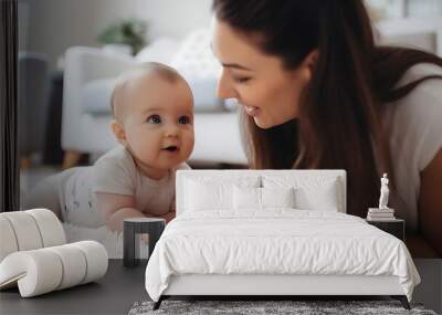 close up, young mother plays her baby on the carpet in living room. Love and care for children. Wall mural