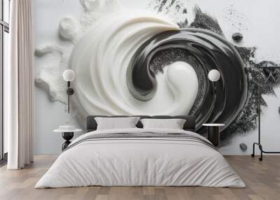 Swirling mixture of white and black materials creating an abstract yin-yang design on a smooth surface under soft lighting Wall mural